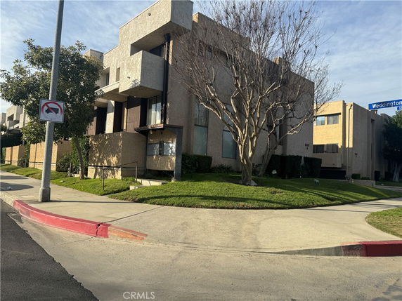 Front view of a multi-story building with a modern architectural design.