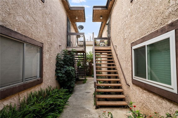 View of exterior with staircase between buildings