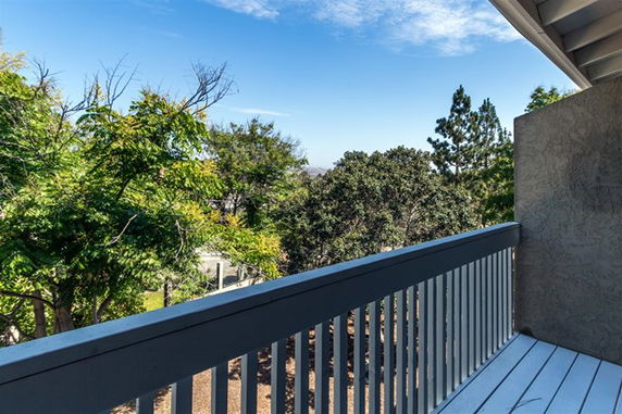View of surrounding areas seen from a building balcony.
