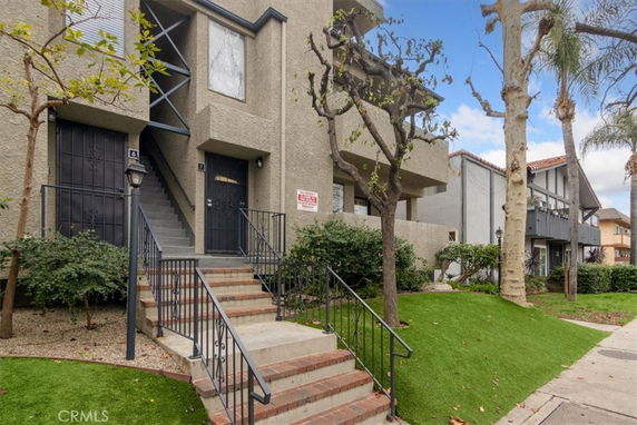 Front view of a multi-story building with stair access.