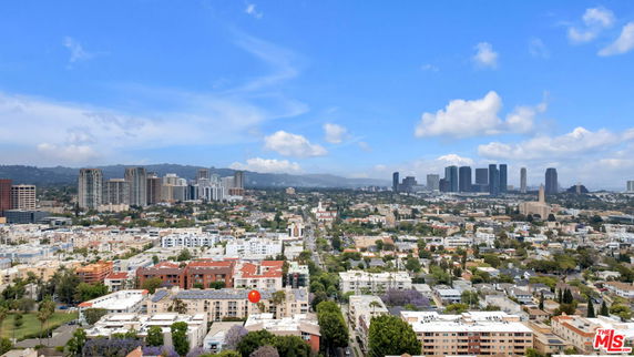 Panoramic view of a cityscape with various buildings and skyscrapers.