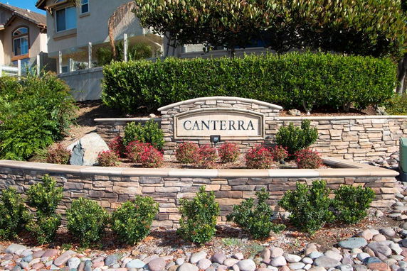 Front view of the stone entrance sign for a residential area named 'Canterra'.