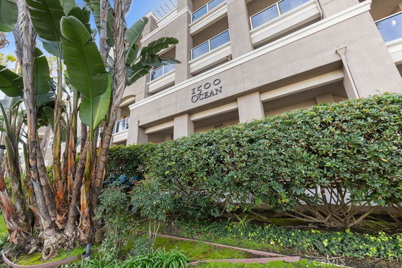 Front view of a multi-story building with large windows and labeled '1500 Ocean.'
