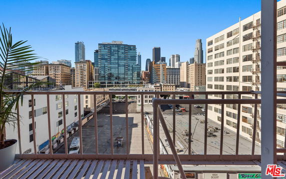 View of the city skyline from a building's balcony.
