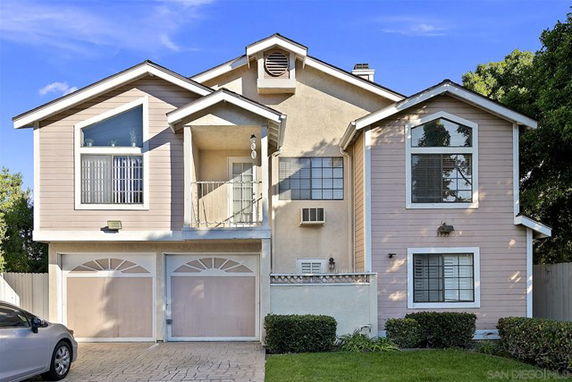 Front view of a two-story house with a double garage.