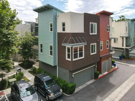 Front view of a modern multi-story house with a garage.