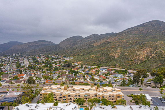 Panoramic view of a residential area with mountains in the background.