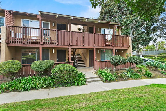 Front view of a two-story residential building with balconies.