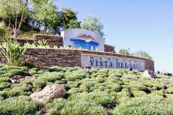 Entrance sign with landscaping and logo.