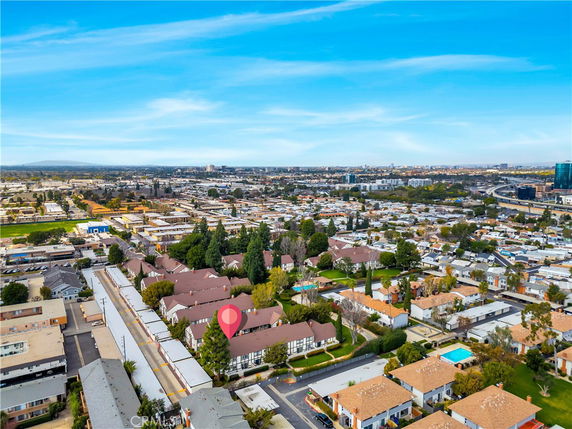 Panoramic view of a residential area with multiple houses and buildings.