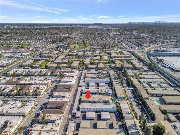 Panoramic view of a residential area with multiple buildings and roads.
