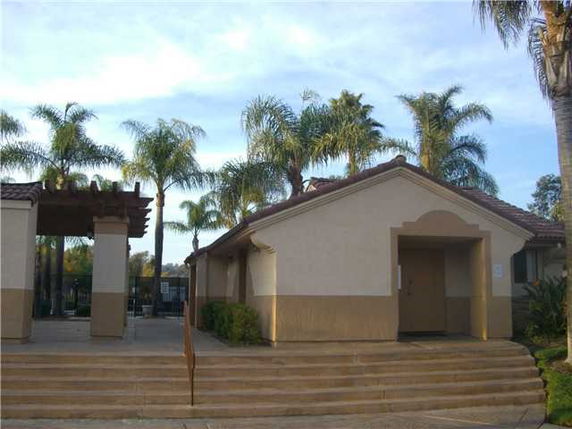 Front view of a building with a tiled roof and entrance steps.