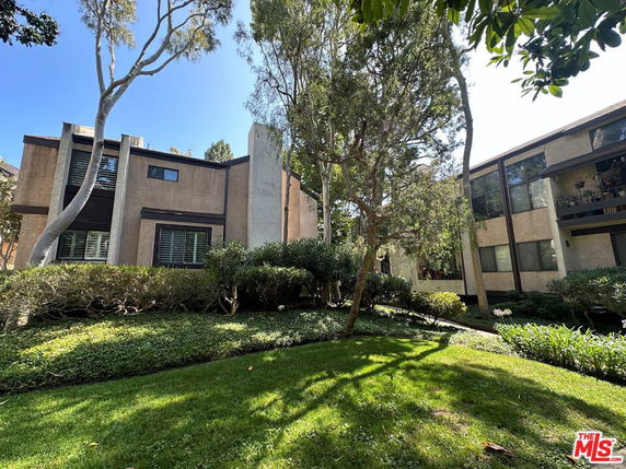 Front view of a multi-story building with modern design elements.