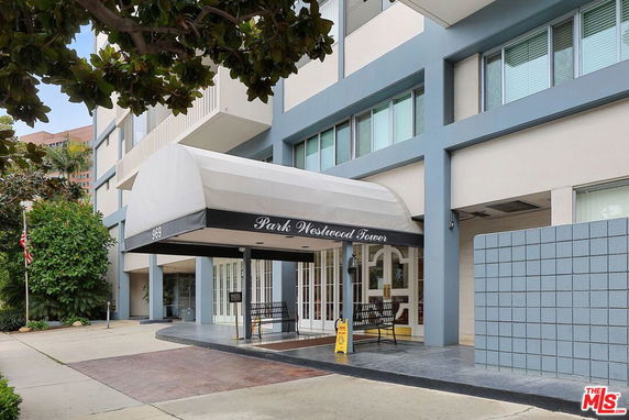 Front view of a building with a covered entrance.