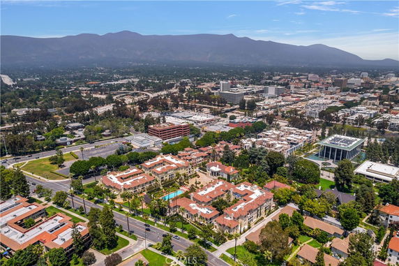 Wide angle view of buildings and surrounding areas from above.