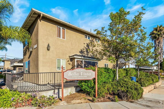 Front view of a two-story condominium building labeled Bella Vista.