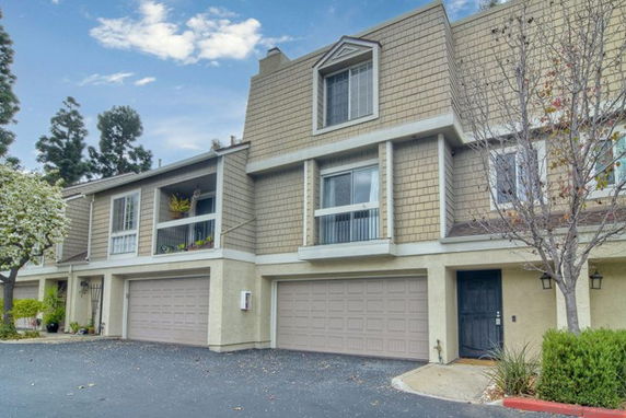 Front view of a two-story house with a double garage.