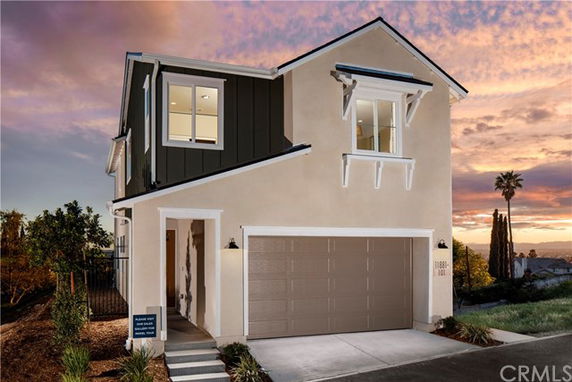 Front view of a two-story house with a double garage.