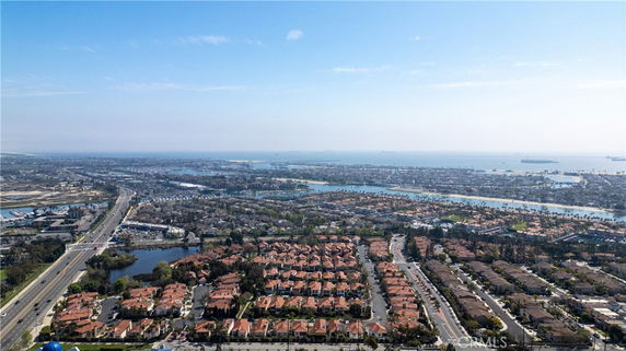 Panoramic view of residential and waterway areas from above.