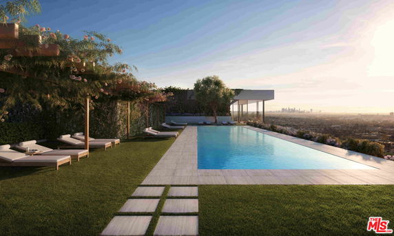 Outdoor swimming pool with lounge chairs and pergola.
