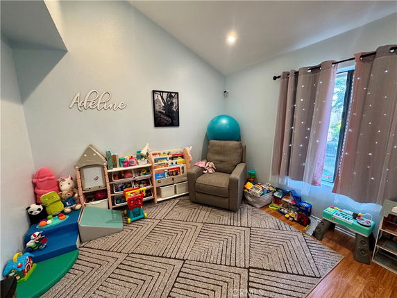 Room with toys and a play area setup for children.