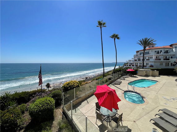 Outdoor swimming pool area overlooking the ocean.