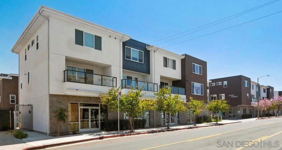 Front view of a multi-story modern residential building.