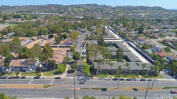 Panoramic view of residential area with multiple buildings and roads.