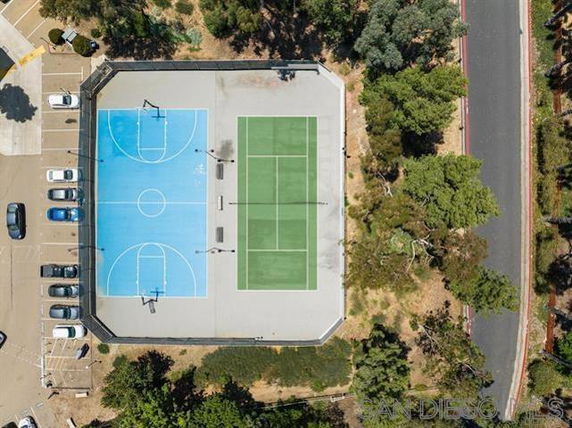 Aerial view of a combined basketball and tennis court area.