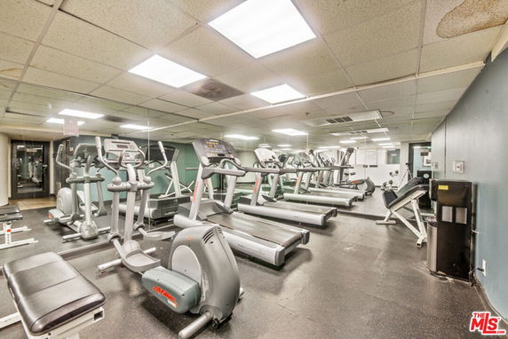 Indoor gym area with treadmills and exercise equipment.