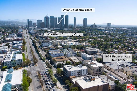 Panoramic view of a cityscape with tall buildings and residential areas.