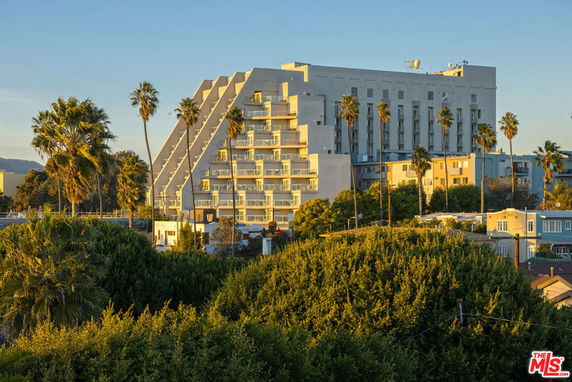 Front view of a multi-story building with a unique stepped architectural design.