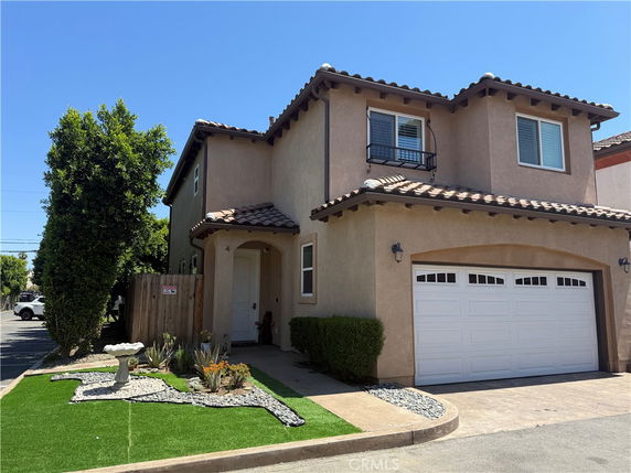 Front view of a two-story house with a double garage.