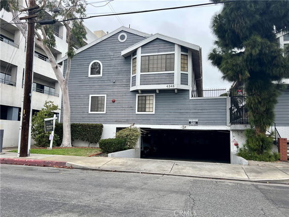Front view of a multi-story house with a garage.