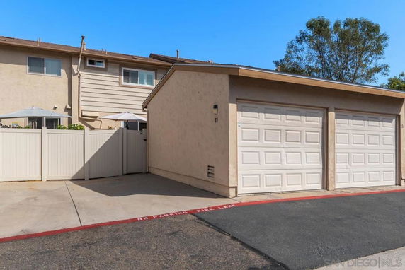 Front view of a two-story house with a garage.