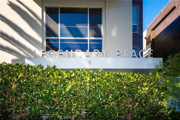 Front view of a building with the name 'Legendary Place' displayed above the entrance.