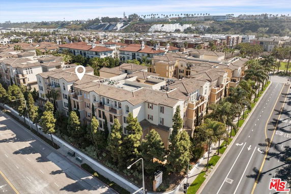 Aerial view of a residential area with multiple multi-story buildings and surrounding roads.