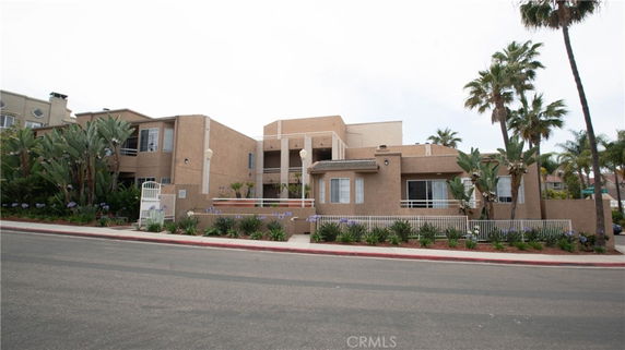 Front view of a multi-story building with a modern design.