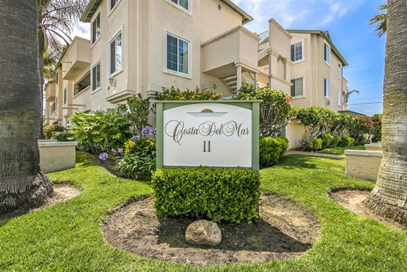 Front view of a multi-story building named Costa Del Mar II.
