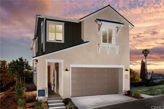 Front view of a two-story house with a garage.