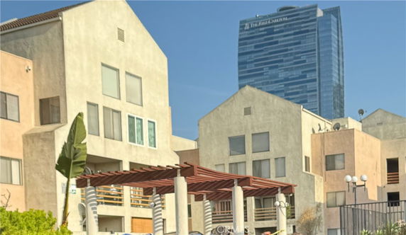 Front view of a multi-story residential building with a modern design.