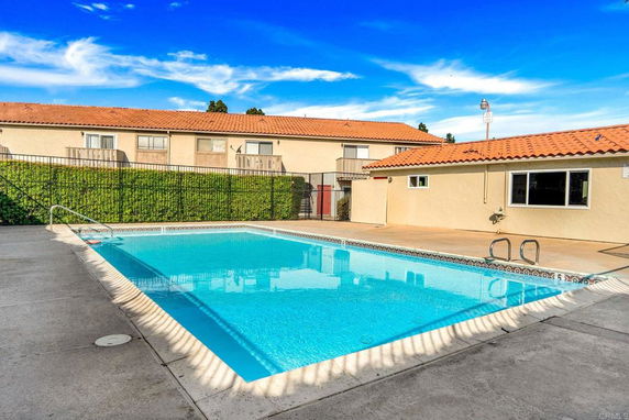 Outdoor swimming pool with adjacent building