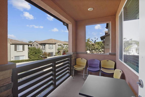 Balcony view overlooking neighboring houses.