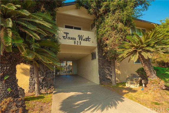 Front view of a two-story building with the name 'Java West' displayed.