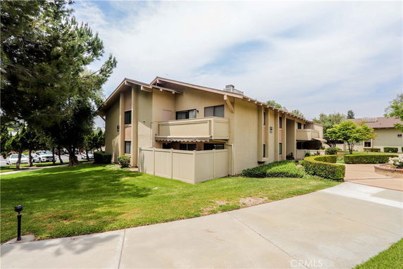 Front view of a two-story residential building with balconies.