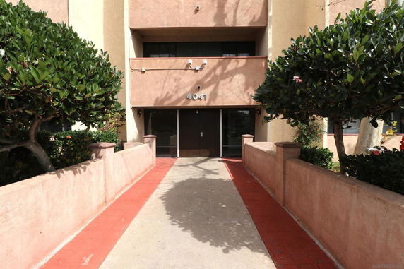 Entrance of a multi-story building with number 4041 above the door.
