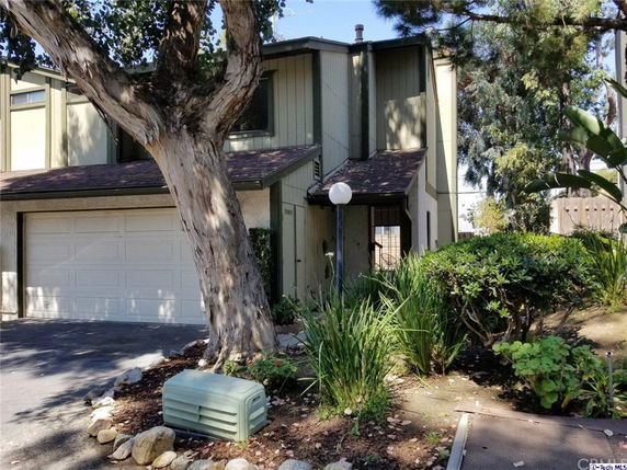 Front view of a two-story house with attached garage.