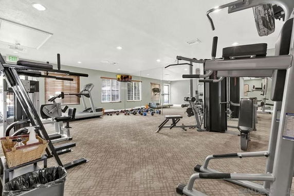 Indoor fitness area with various exercise equipment.