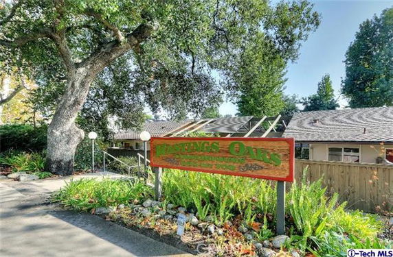 Front view of a building with a sign reading 'Hastings Oaks'.