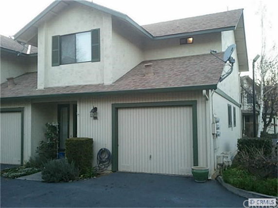 Front view of a two-story house with a single garage.